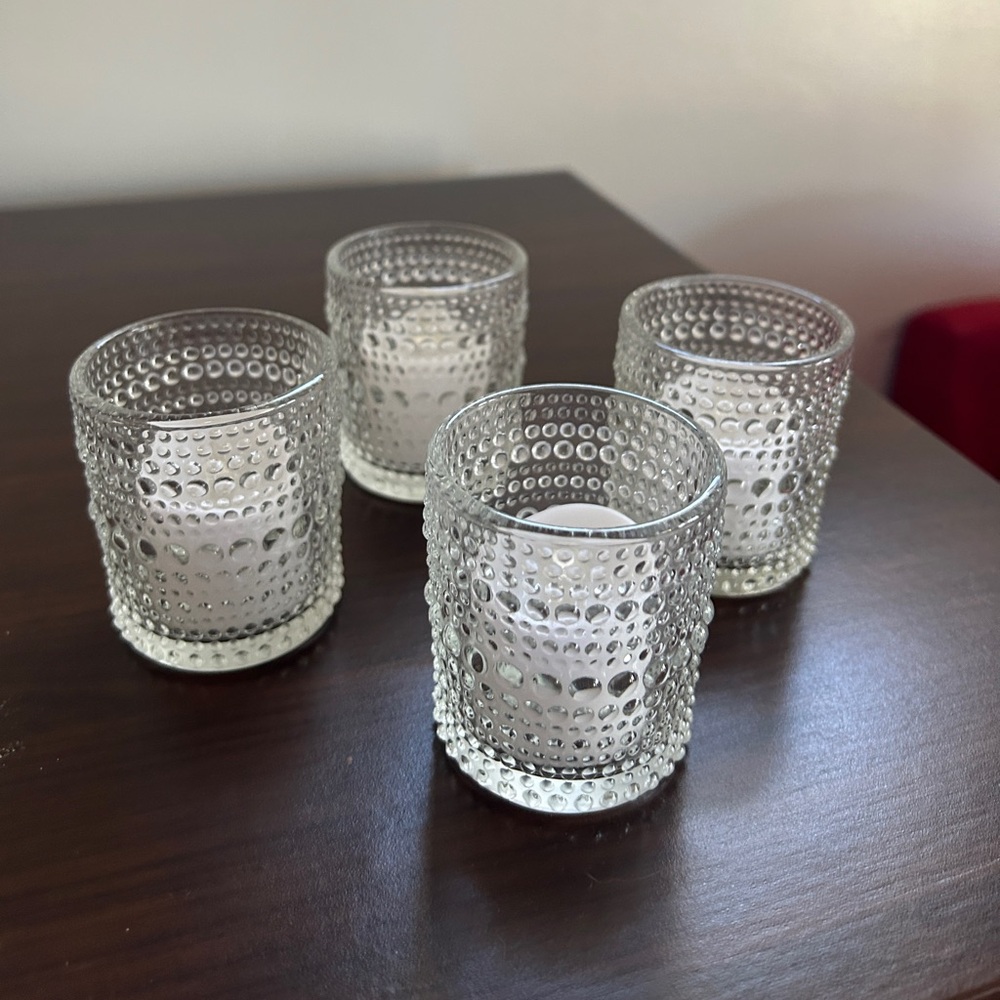 Set of 18 glass votive candle holders with tea lights